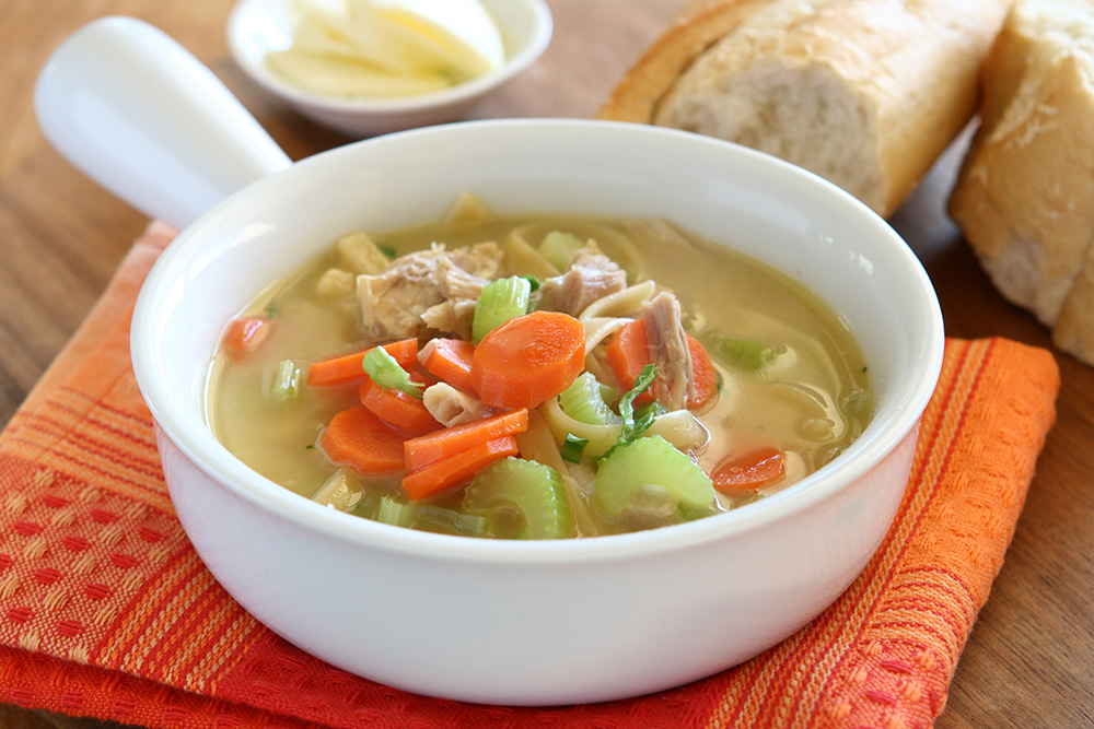 Stock image of a bowl of turkey noodle soup